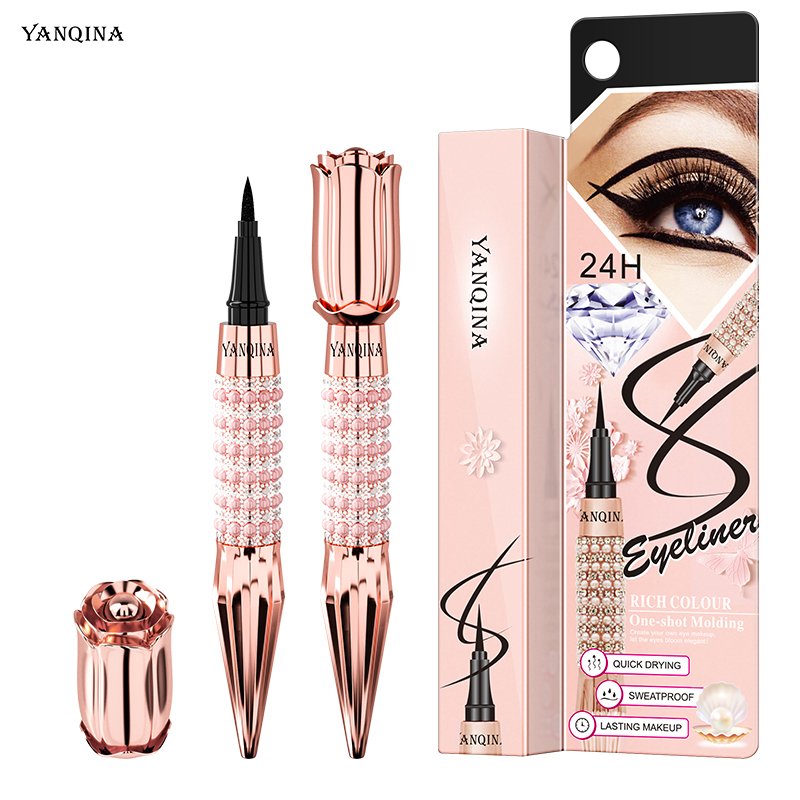 Black waterproof liquid eyeliner pen with soft felt tip and rose gold crystal packaging