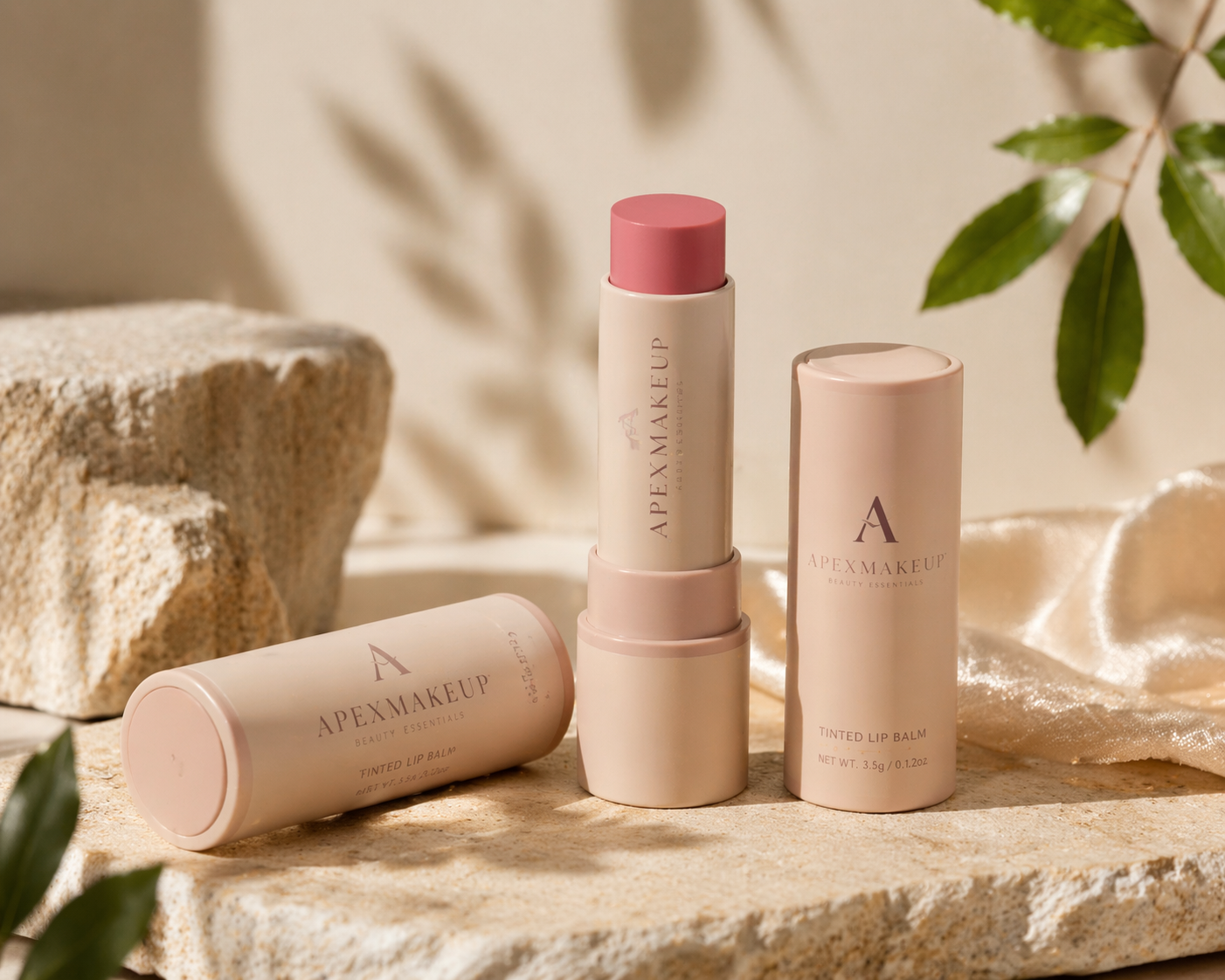ApexMakeup tinted lip balm products displayed in a soft minimal beauty still life scene